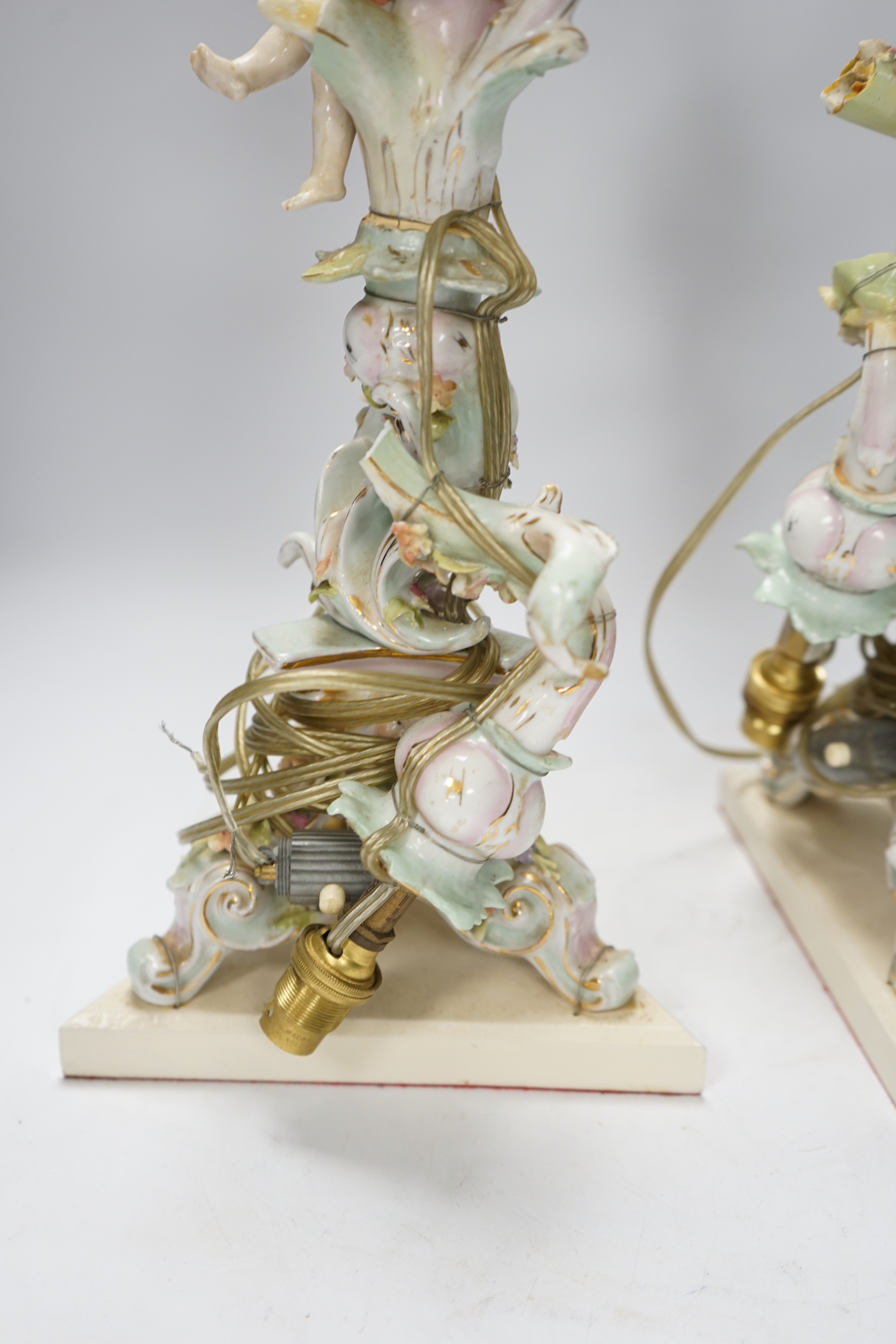 A pair of Sitzendorf floral encrusted porcelain table lamps, 42cm total